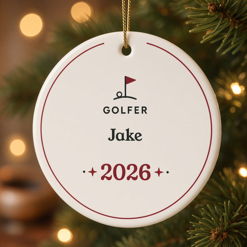 Close-up of the glossy ceramic golfer ornament showing the golf flag, GOLFER, the name Jake and 2026